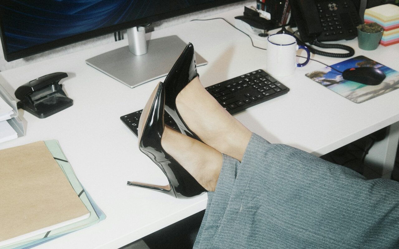 Melbourne web designer with feet on desk at her laptop
